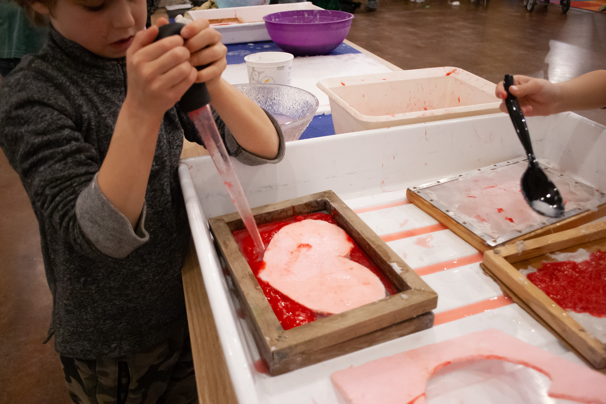 Children exploring science with tools and materials
