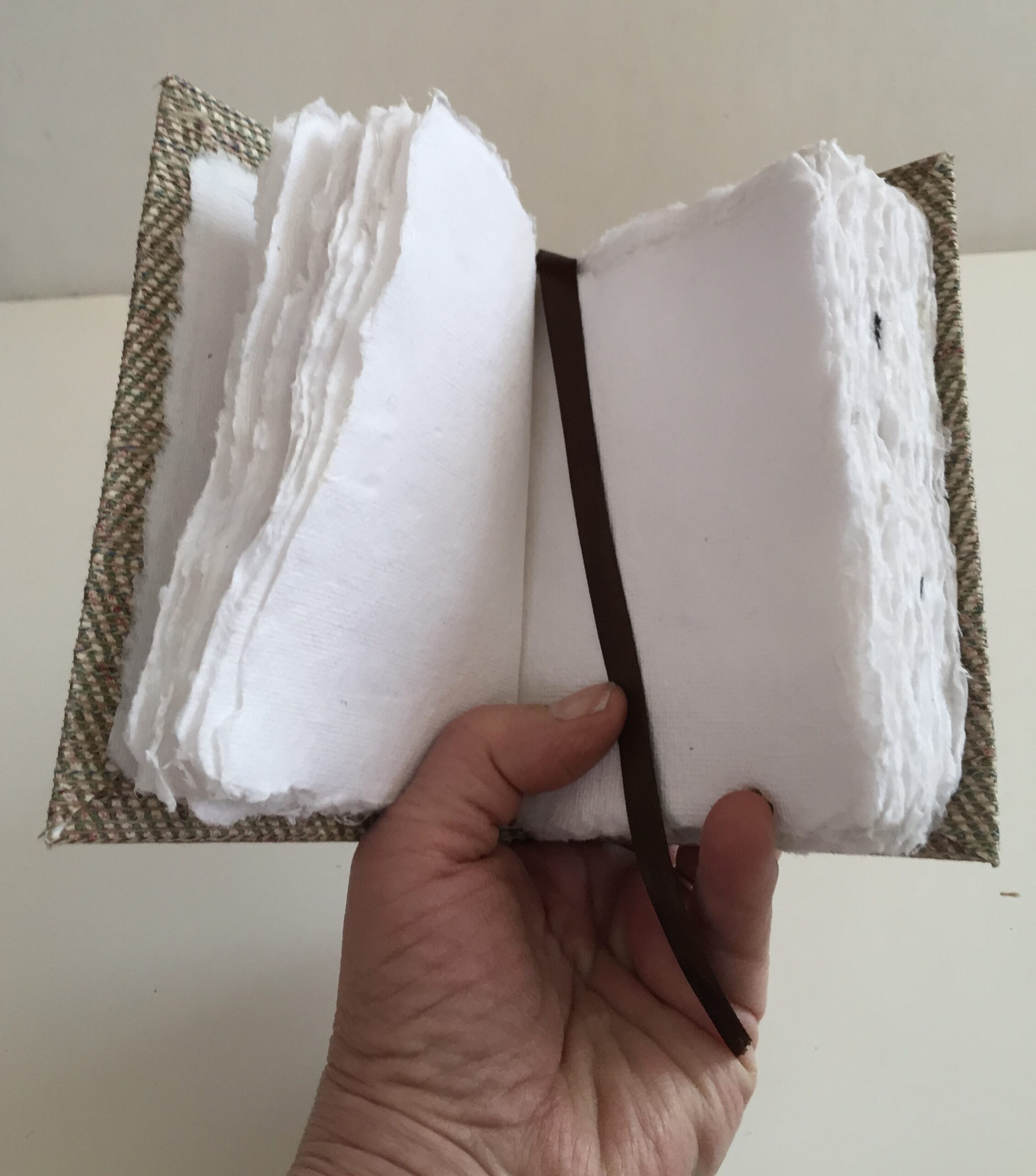 Open notebook with a fabric cover