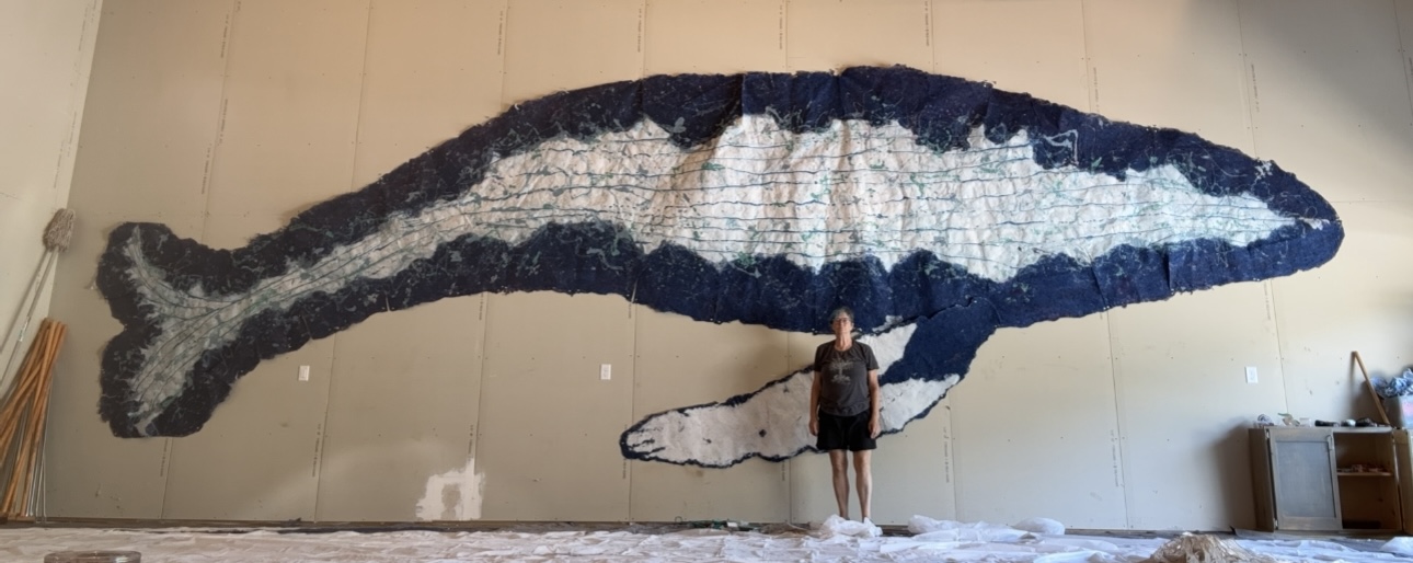 Massive whale artwork on wall display