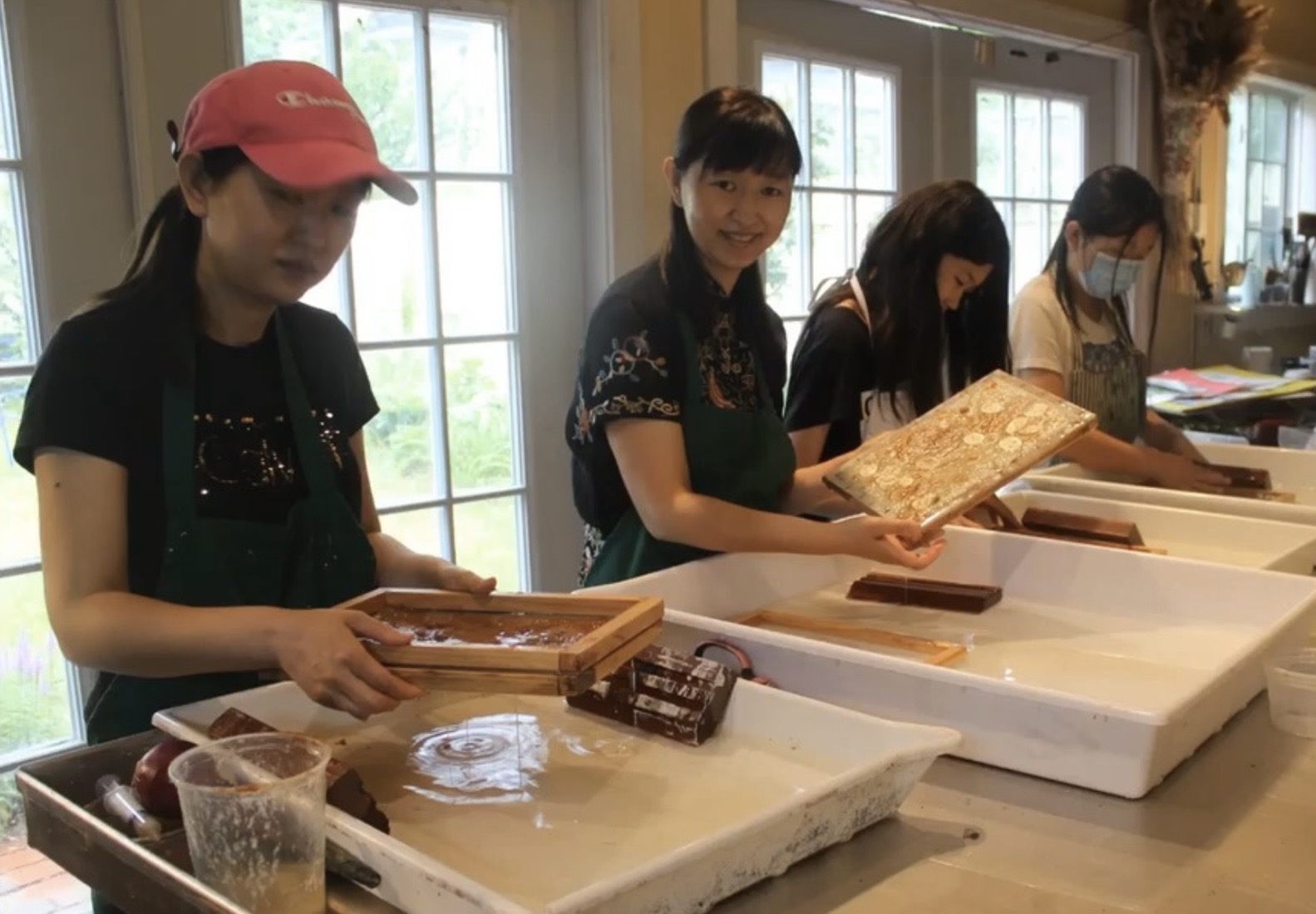 Participants engaged in paper-making process