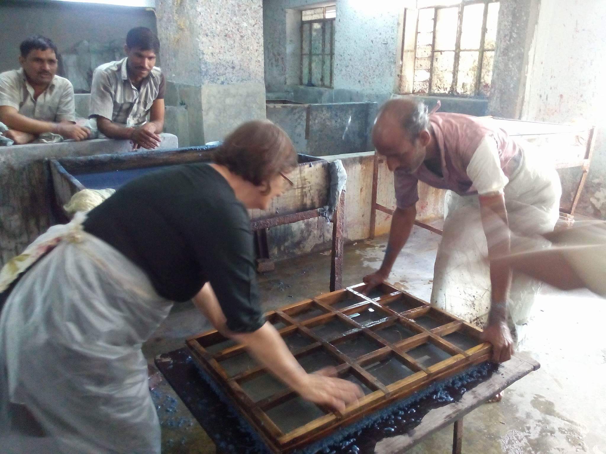 People crafting handmade paper