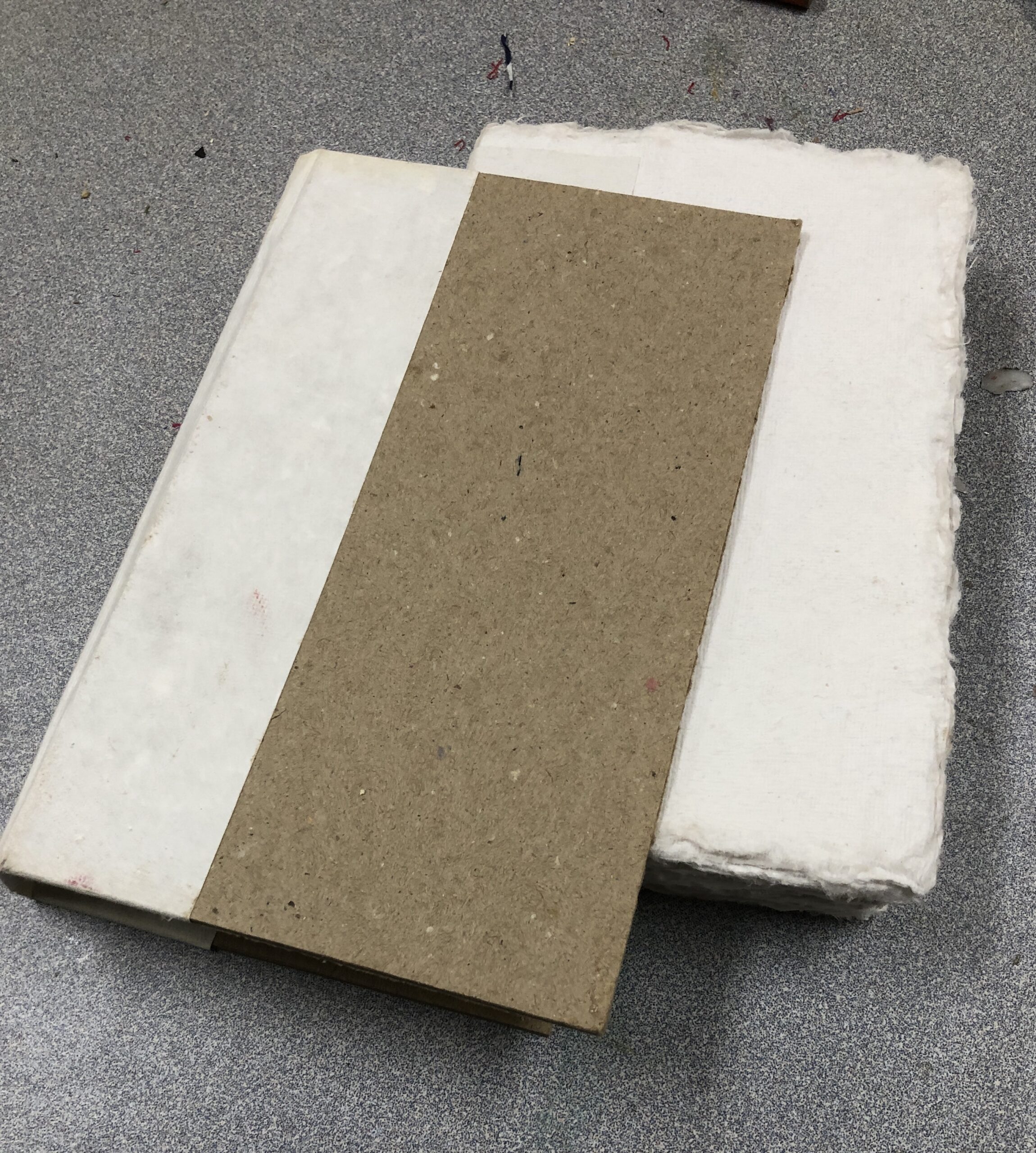 Handmade paper stack on gray surface